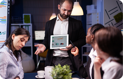 Team discussion with tablet and charts
